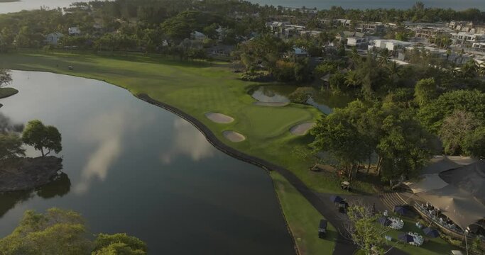 Aerial view of Winged Foot Golf Course with idyllic landscape and water reflection, Constance, Flacq, Mauritius.