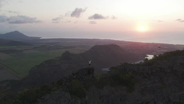 Aerial view of Bambous, Corps de Garde in sunset with hiker climbing, Mauritius.