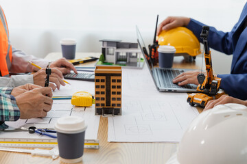 Engineering team at the meeting Construction concept of meeting engineer or architect for project working with partners and engineering tools in modeling and blueprint design in office