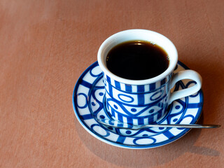 cup of coffee on wooden table