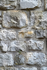 Vertical Texture of a stone wall. Old castle stone wall texture background.