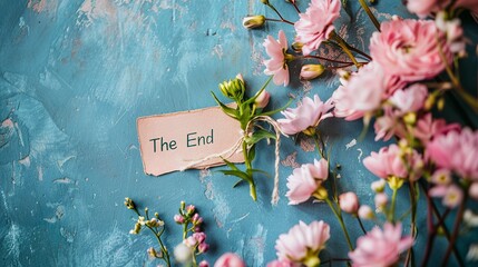 The end text surrounded and background with spring flowers - obrazy, fototapety, plakaty