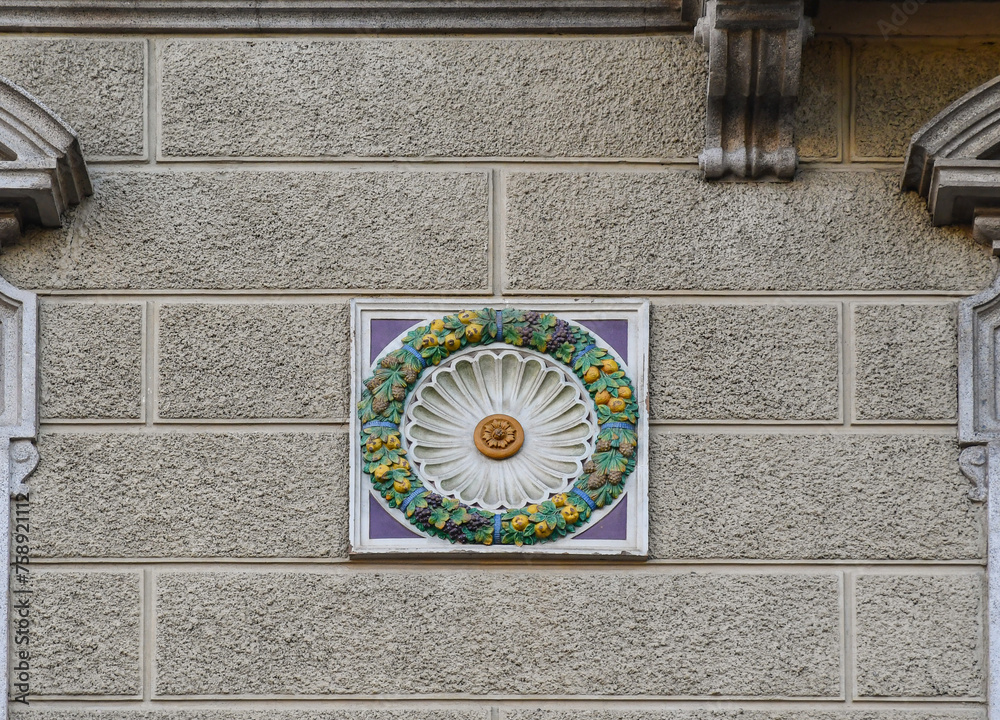 Wall mural Colorful decoration in the shape of fruit garland on the facade of an old building, Turin, Piedmont, Italy