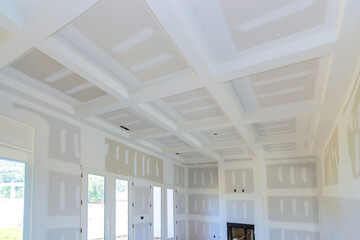 Construction of new home with gypsum plaster walls drywall that is ready for painting