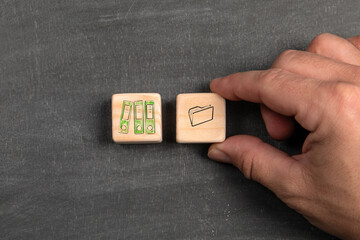 Accounting and data processing concept. Wooden blocks on a dark chalkboard background
