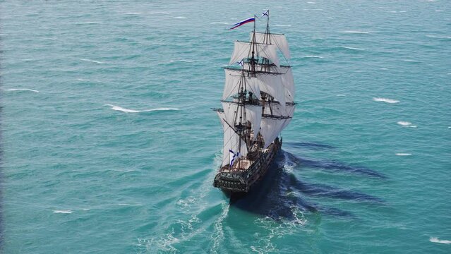 Sailboat floating in the ocean, aerial view