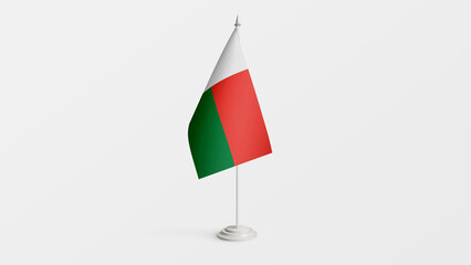 Madagascar national flag on stick isolated on white background. Realistic flag illustration