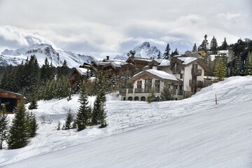 Winter scenery of ski resort Courchevel with its chalets on the slopes 