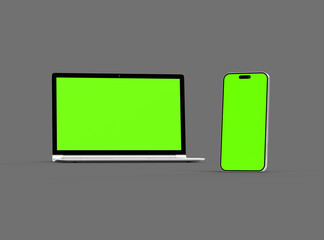 3D Render of laptop and phone with green screen on a dark background