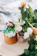 Easter celebration, Child in nature with Easter cake and eggs and Easter decor