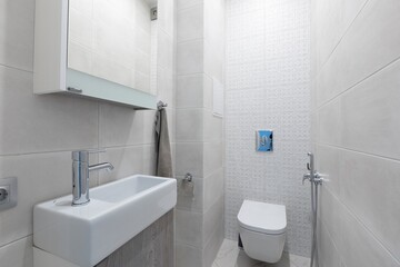 modern bathroom room with toilet and washing machine