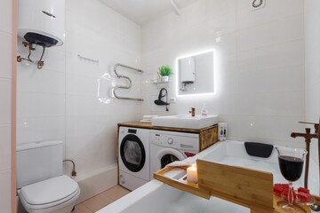 modern bathroom room with toilet and washing machine