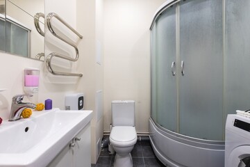 modern bathroom room with toilet and washing machine