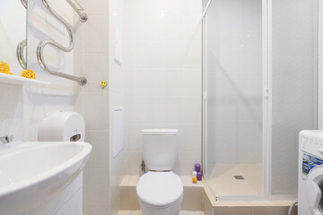 modern bathroom room with toilet and washing machine