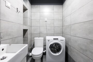 modern bathroom room with toilet and washing machine