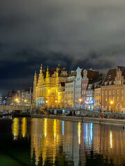 Lights of old Gdańsk, Poland reflecting in the canal water in evening