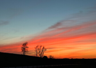 Colorful prairie sunset in red, orange, and blue