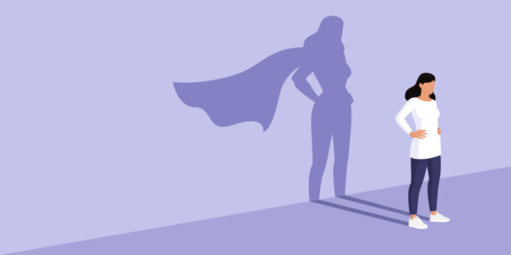 Confident woman with superhero shadow