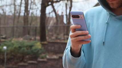 A man using his cellphone outside