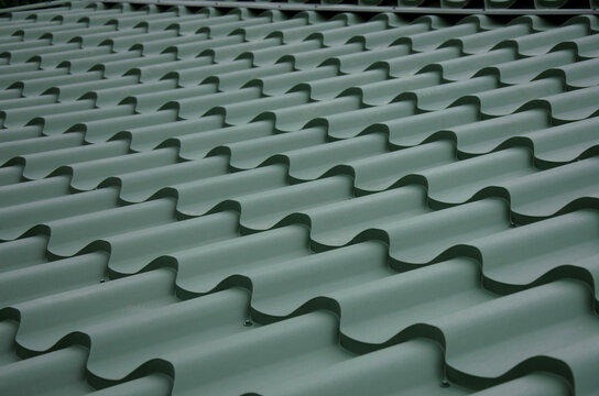 Green metal roof tile wave