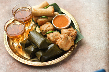Lontong and Gorengan. Indonesia traditional snack very popular during ramadan for iftar served with hot tea. Iftar concept for Ramadan Kareem. 