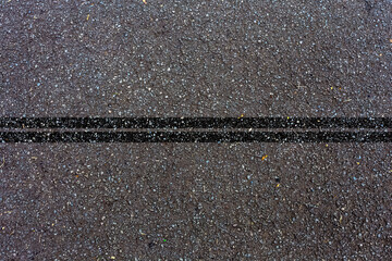 Fototapeta premium Lignes noires sur asphalte 