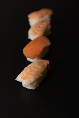 Sushi nigiri with boiled shrimp and raw Atlantic salmon