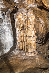 Stalagmite located in the Bazinele Mici area of the Womans Cave (aka Pestera Muierii), Gorj county, Romania. - 758975909