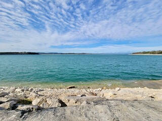 Sea beach with rocks and the sky