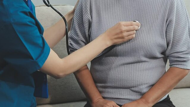 Doctor, senior patient and heart beat, stethoscope and consultation with cardiology and check breath sound. Help, trust and healthcare, male physician and woman at hospital with cardiovascular health