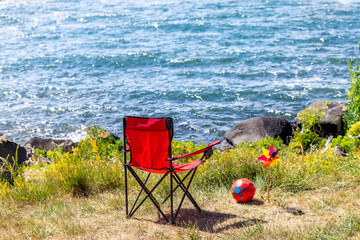 Relaxing summer scene with empty chairs facing a serene lake. Summer holiday background. Ardahan, Turkey.