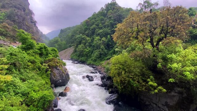 Storm clouds over mountains of Jang town deep in the  nurangang river bridge in tawang district of arunachal pradesh in India.