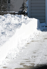 Fototapeta na wymiar Plowed Snow on Driveway