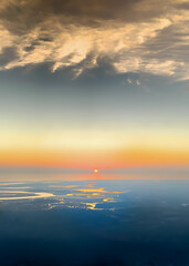 Aerial view of the horizon with the sun rising pushing the night away