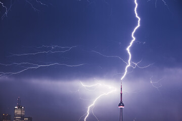 CN Tower being struck by lightning in Toronto, Ontario, Canada at night. 