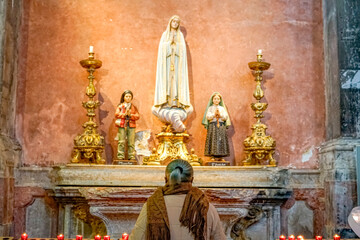 
religious figures of saints of the catholic church, our lady of Fatima, santo Francisco Marto, santa Jacinta Marto, whith prayer.lisbon
