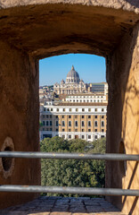 Dome of Saint Peter s Basilica in Vatican seen through a window of Castel Sant Angelo in Rome,...