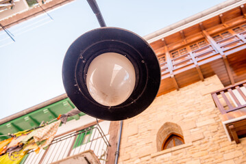 a street lamp, a lantern in a historic city in Spain. street lighting in the historical center of the city.