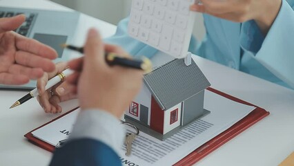 Real estate broker agent being analysis and making the decision a home estate loan to customer to signing contract documents for realty purchase, Bank employees recommend mortgage loan approval.
