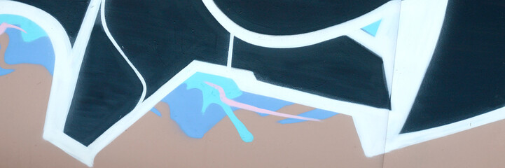 Colorful background of graffiti painting artwork with bright aerosol outlines on wall. Old school...