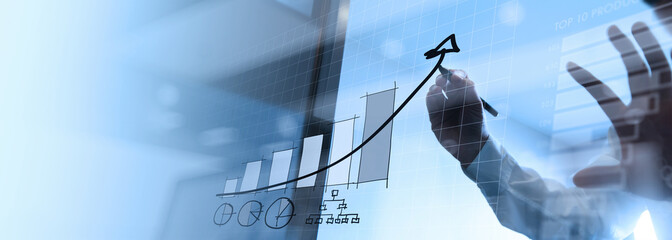 Businessman draws a plan graph growth increase of chart positive indicators of business top ten products graph corporate future growth plan and economy growing growth in office.