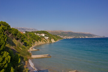 Seascape with beach and mountains in the background. Croatia, Adriatic coast.