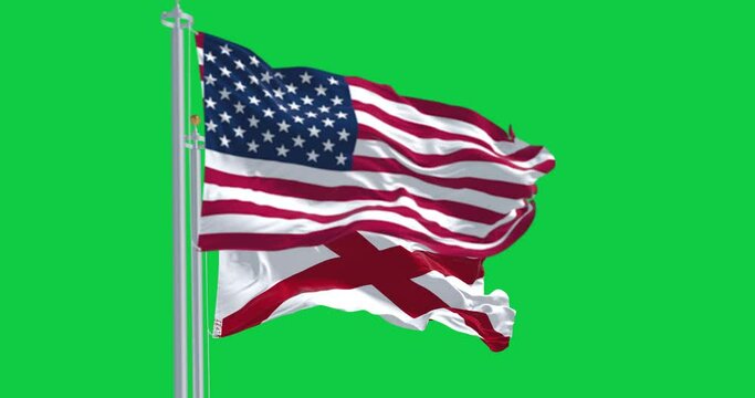 Alabama and the United States flags waving isolated on green background
