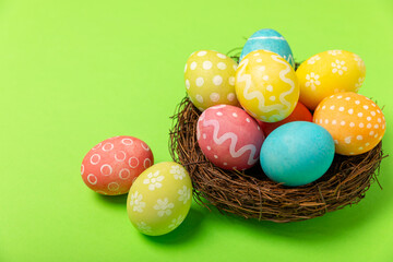 Easter eggs on a bright background. Easter celebration concept. Colorful easter handmade decorated Easter eggs. Place for text. Copy space.
