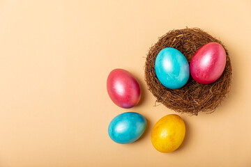 Easter eggs on a bright background. Easter celebration concept. Colorful easter handmade decorated...