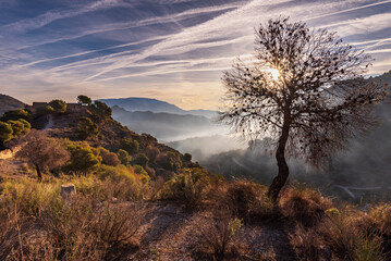 Dawn at the El Castillejo de Los Guajares site, an old fortified town from the Arab era located on the top of a mountain on the coast of Granada, Andalusia.