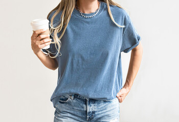 Girl Blue Jean t shirt template. Model in blue Tshirt Mock Up. Woman poses in a white  background	