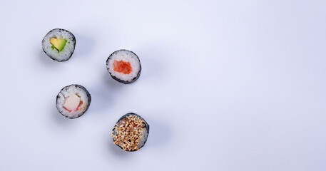  sushi maki rolls on white background