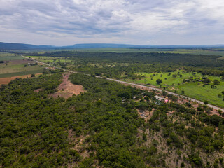 Fototapeta na wymiar Aerial landscape of farmland in Bom Jardim during summer in Nobres countryside in Mato Grosso