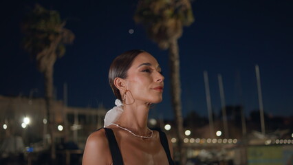 Beautiful lady going street on romantic date late evening closeup. Woman walking